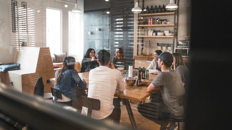 Team gathered around a large table