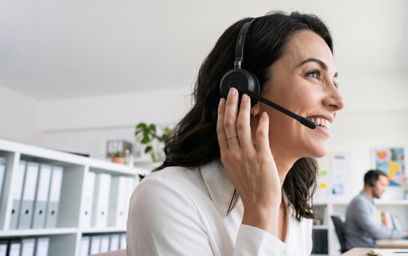 Smiling advisor wearing a headset