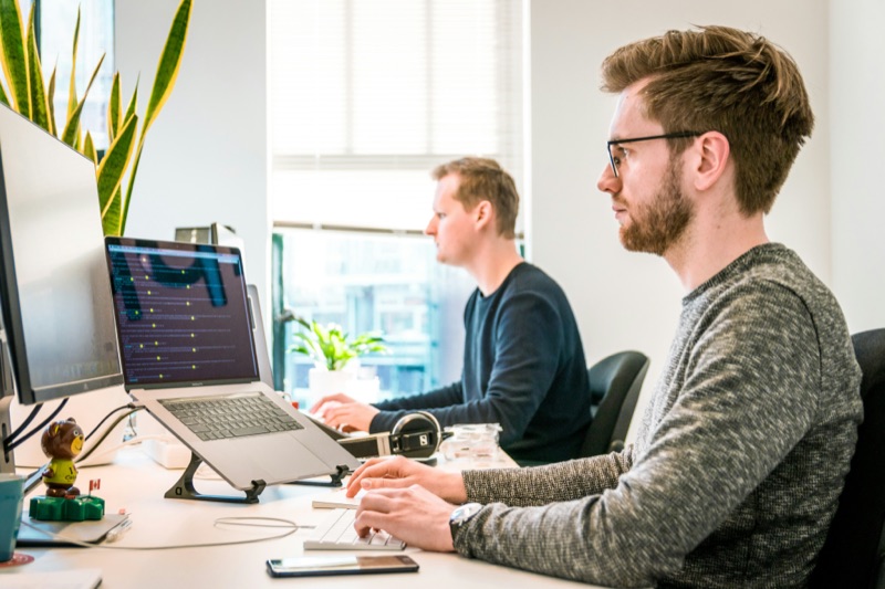 Two developers working side by side
